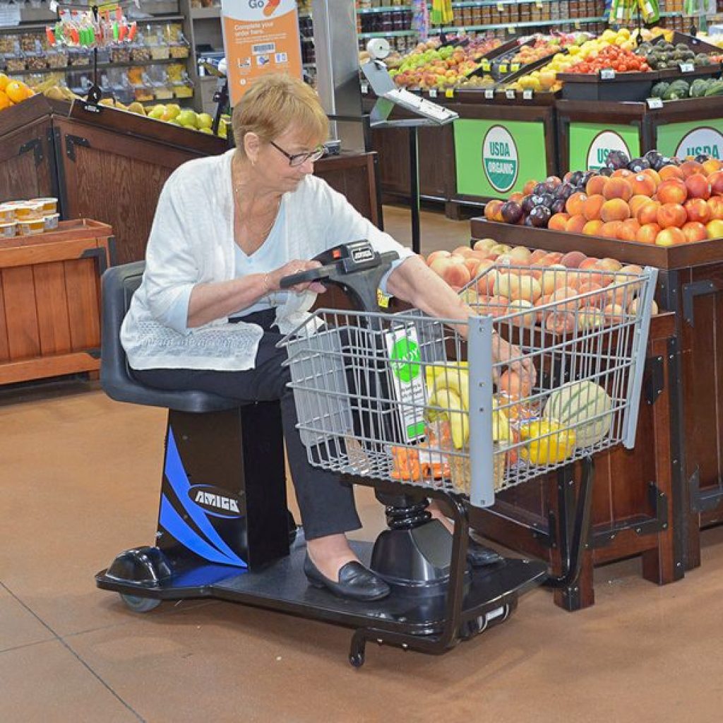 Amigo Valueshopper electric shopping cart woman buying produce