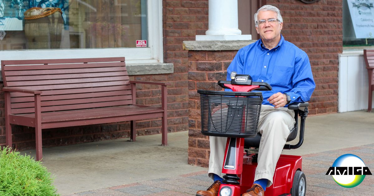 Male Amigo RD user sitting on front porch